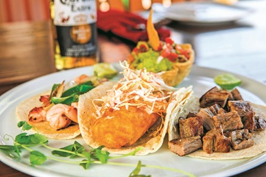 Captain Tonys traditional palapa restaurant under marina night lights